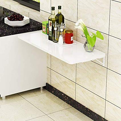 Mesa abatible en la cocina. Vía Pinterest.